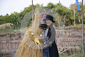 Travelers thai women people travel visit and posing portrait for take photo straw puppets or straws man figure Festiva