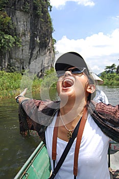 Travelers thai women people travel visit shooting take photo on boat tour trip Tam Coc Bich Dong or Halong Bay on Land and Ngo