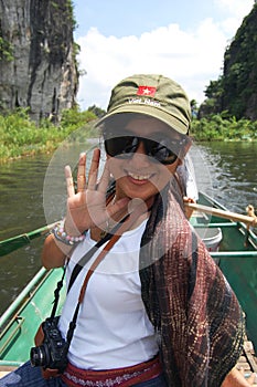 Travelers thai women people travel visit shooting take photo on boat tour trip Tam Coc Bich Dong or Halong Bay on Land and Ngo