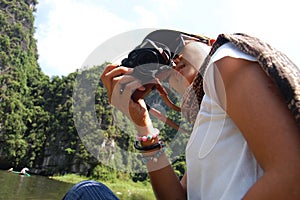 Travelers thai women people travel visit shooting take photo on boat tour trip Tam Coc Bich Dong or Halong Bay on Land and Ngo