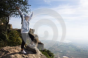 Travelers thai women people visit posing portrait take photo on stone cliffs of Khao Phraya Doen Thong viewpoint and view