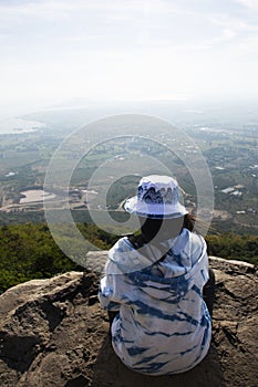 Travelers thai women people visit posing portrait take photo on stone cliffs of Khao Phraya Doen Thong viewpoint and view