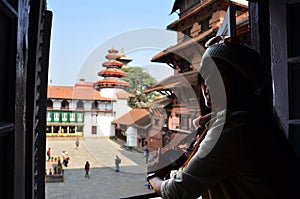 Travelers thai women photographer travel visit and take photo ancient nepalese architecture and antique Nasal Chok Hanuman Dhoka