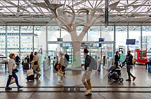 Travelers walking in the concourse of the SNCF train station in Nantes, France