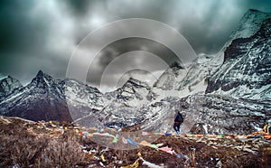 Travelers walking with snow capped mountain background to Milk Lake and Five colors lake in Yading Nature Reserve