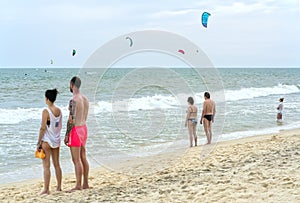 Travelers are watching Kite Surfers