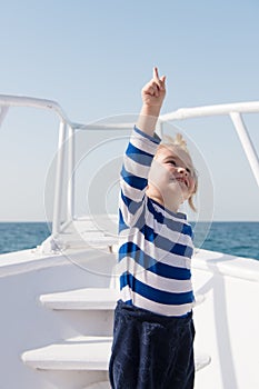 Traveling adventures and wanderlust. summer traveling vacation. childhood happiness. happy small boy on yacht. boat
