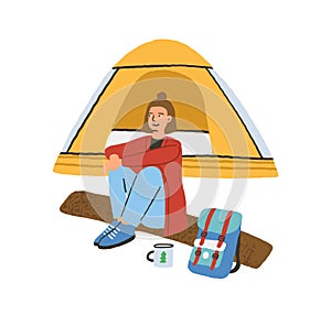 Traveling alone concept. Young woman sitting on log near camping tent. Enjoying outdoor recreation in solitude. Colorful