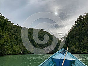 traveling by boat at Kabui Bay, Gam island, Raja Ampat - West Papua, Indonesia