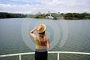 Traveling in Brazil. Panoramic view of tourist woman looking the Pampulha Modern Ensemble in Belo Horizonte, UNESCO World Heritage photo