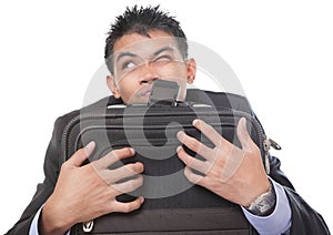 Traveling businessman grasping case photo