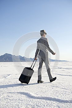 Traveling Businessman Walking with Luggage
