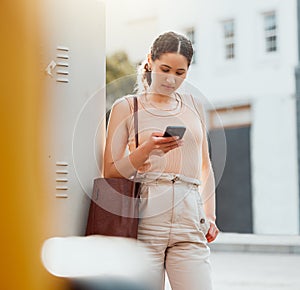 Traveling businesswoman with a phone texting, browsing internet while waiting outside for transport or replying to text