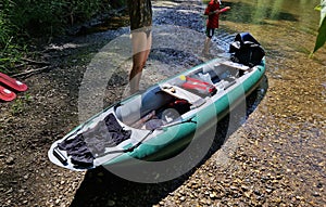 traveling on a canoe raft down the river. inflatable boat with paddles