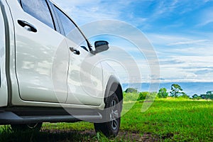 Traveling by car. Freedom car travel in holiday background concept with green nature and bright blue sky. Travel with pickup car