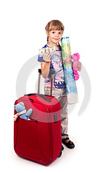 Traveling with children. Tourism. Cute little girl and big red suitcase isolated on white background