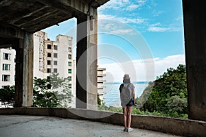 Traveling girl in a abandoned building