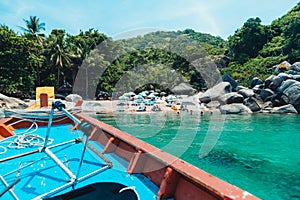 traveling on a long-tail boat on the bay at Koh Tao