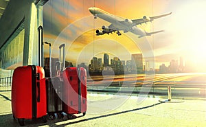 Traveling luggage in airport terminal building and jet plane fly photo