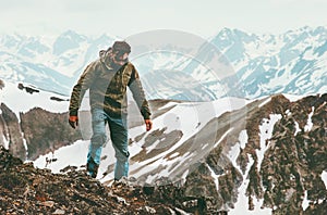 Traveling Man alone hiking in mountains Lifestyle survival concept photo