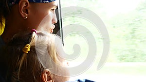 Traveling mother and daughter in mini bus. Transportation concept and idea shot.