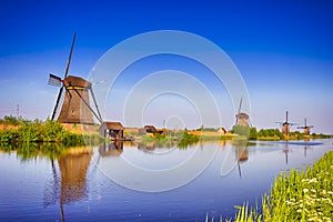 Traveling Through The Netherlands. View of Traditional Romantic Dutch Windmills in Kinderdijk Village