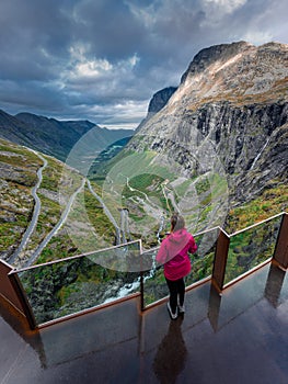 Traveling Norway - Woman admires views from the Trollstigen platform