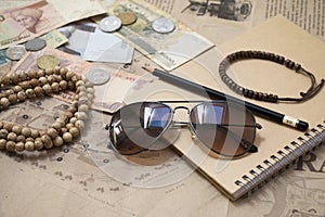 Traveling retro still life with map, sunglasses, money, coins, b