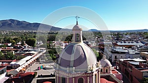 Traveling shot behind the dome of the Tequisquiapan church