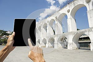 Traveling Tourist Using Tablet at Lapa Arches Rio de Janeiro Brazil