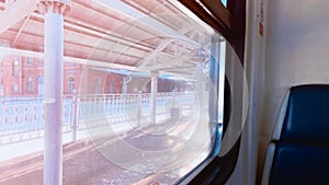 Traveling by train background with copy space. Large window and seat at suburb train. Inside car of train. Railway