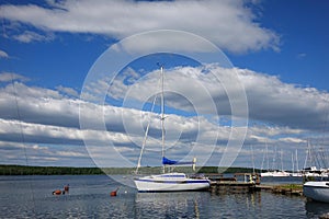 Traveling under sail.Sailboat sail off into the sunset on Lake.