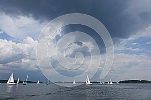 Traveling under sail.Sailboat sail off into the sunset on Lake.