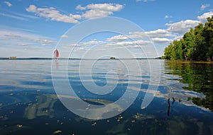 Traveling under sail.Sailboat sail off into the sunset on Lake.