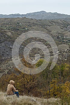 Traveller man in autumn mountains