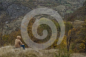 Traveller man in autumn mountains