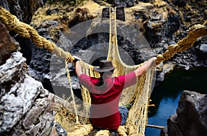 Traveller on a rope bridge