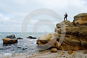Traveller standing on the top of limestone rock,Odessa,Black Sea