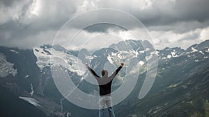 Traveller and summer mountain stormy landscape