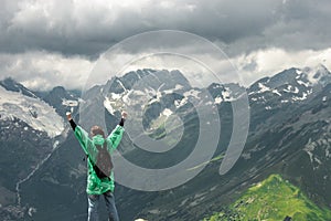 Traveller and summer mountainHappy traveller on the top of mountain stormy landscape