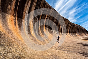 Traveller take photo a Wave rock