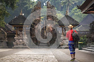 A traveller travel in Holy Spring Water Tirta Empul Hindu Temple