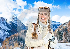 Traveller woman with vintage photo camera