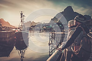 Travellers couple in Reine village, Norway