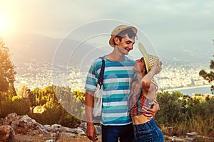 Travellers walk and admire the top view of Alanya. Young couple enjoy summer vacation.