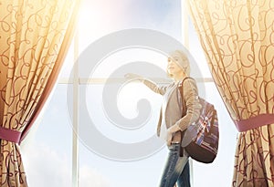 Travelling And Accomodation Concept. Girl Standing Near Big Window