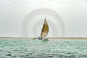 travelling Africa Kenya and Zanzibar seascape with crystal clear turquoise water and traditional sail boat landscape