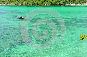 Travelling boat on the crystal clear water