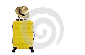 Travelling concept with yellow luggage with hat and yellow sun glasses