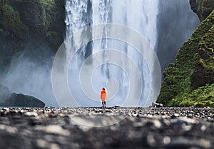 Travelling on Iceland. Skogafoss waterfall and tourist. Famouns place in Iceland.